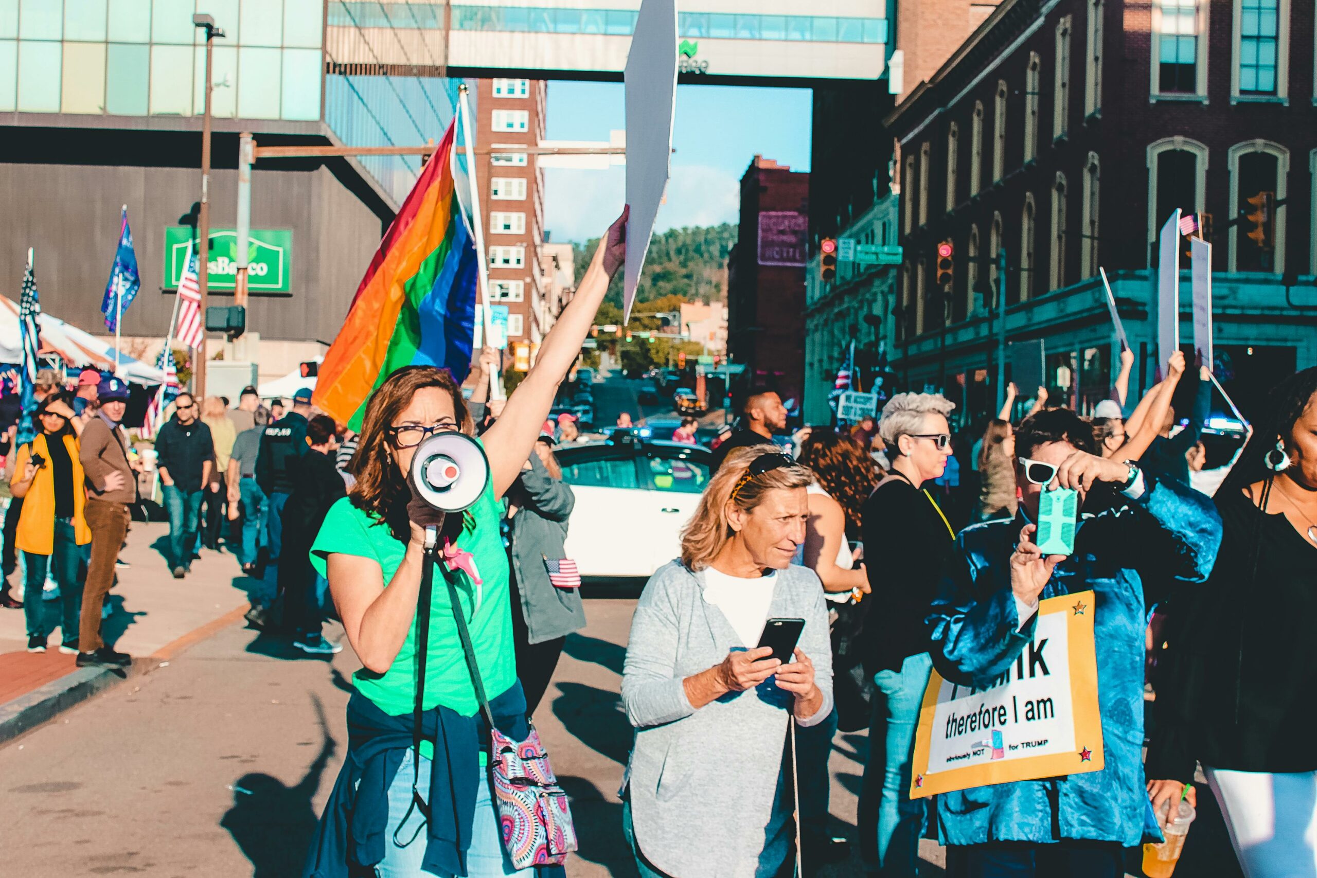 pexels-ketchumcommunity-1464223 image of a protest with a rainbow flag in the background